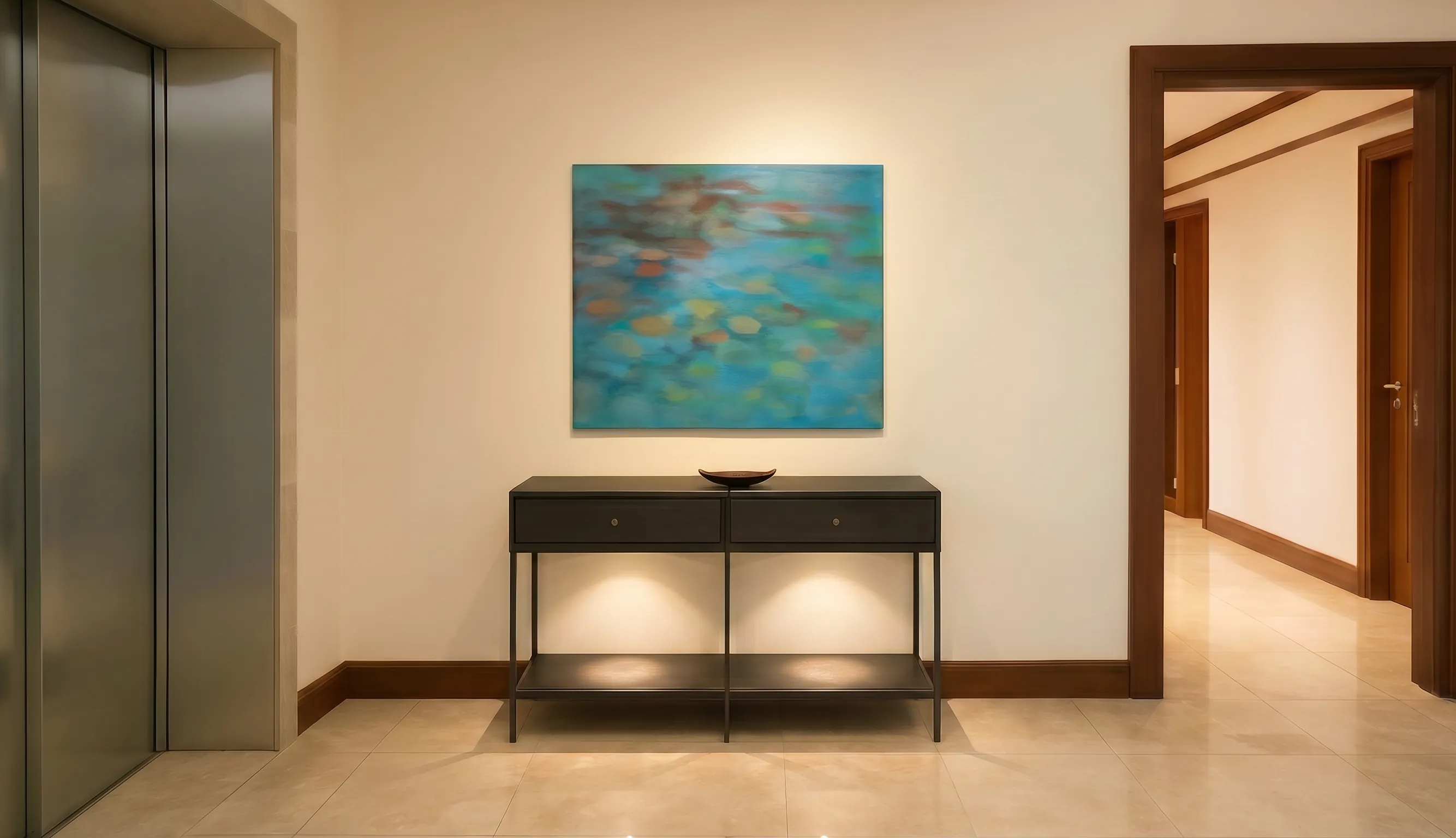 Refined hallway with console table and abstract teal artwork